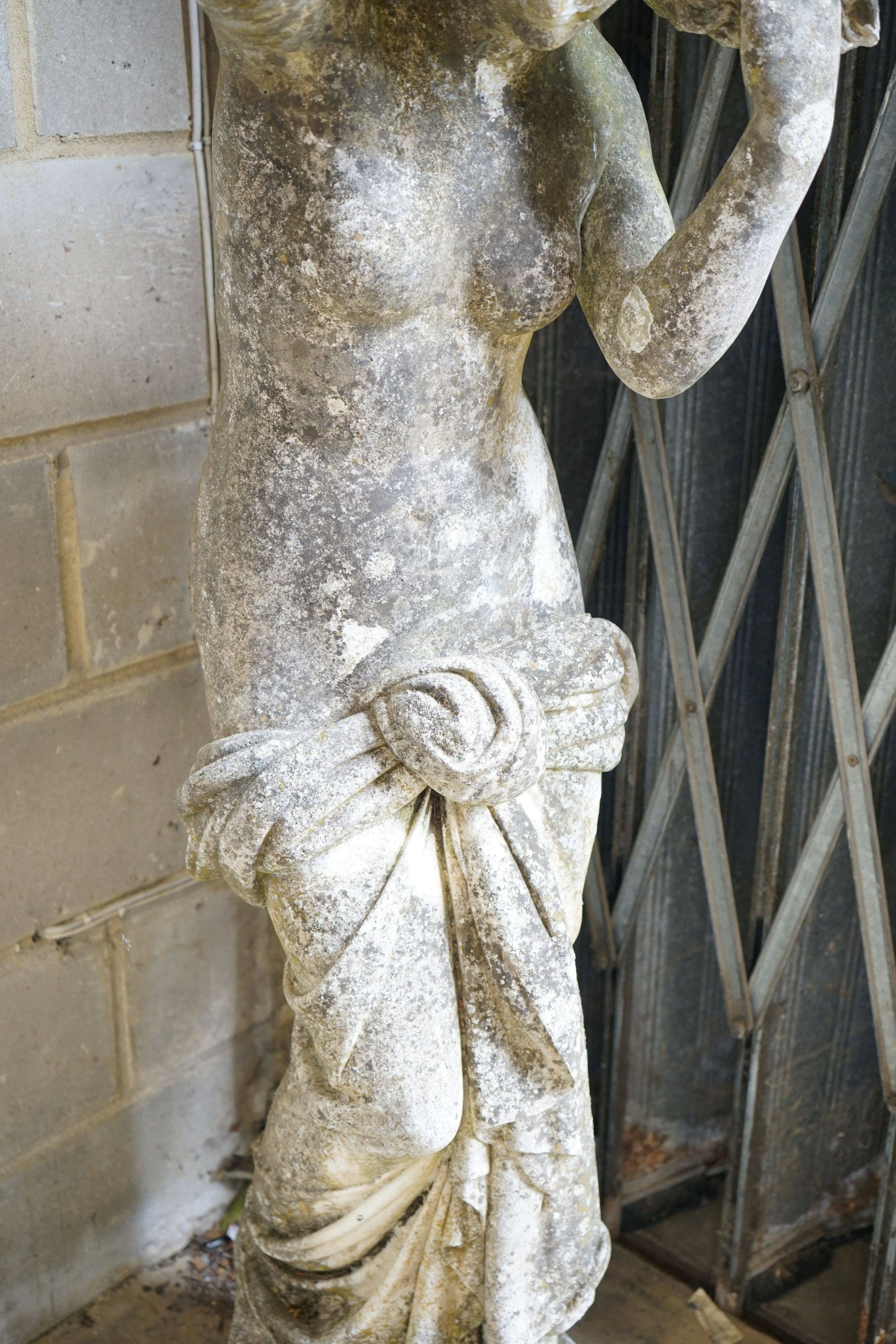 A weathered reconstituted stone garden statue of a robed female figure, height 155cm